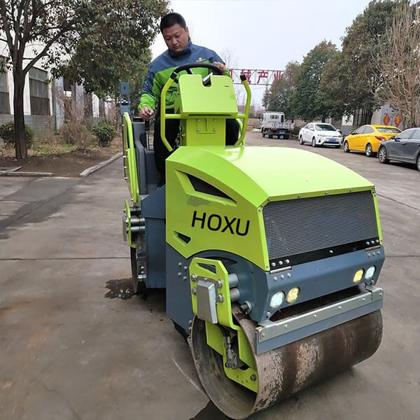Articulated double drum vibratory road roller