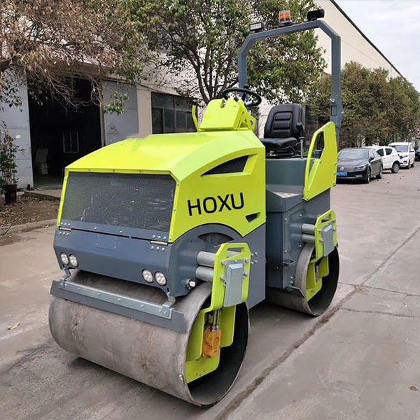 Articulated double drum vibratory road roller