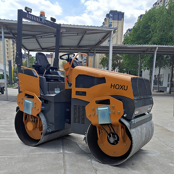 Articulated double drum vibratory road roller